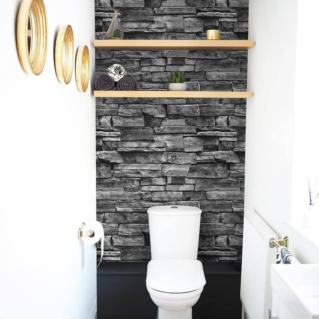 Dark gray brick-pattern wallpaper behind a white bathroom toilet and vanity.