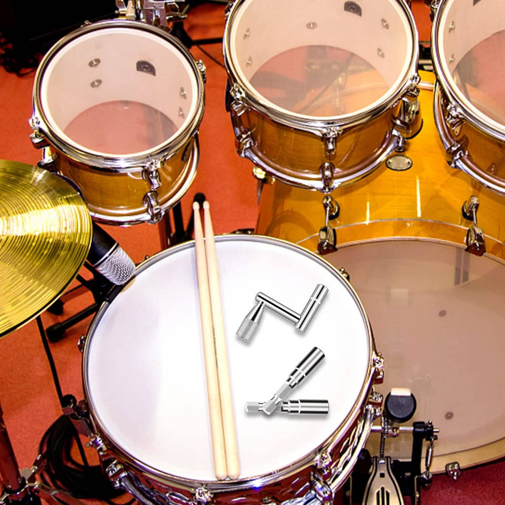 Drum tuning key and drill bits on a drum set with mallets