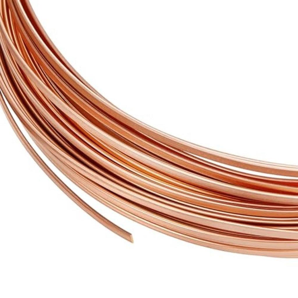 Copper wide flat bezel wire coil, 26 gauge, 1mm strip, multiple loops shown