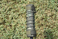 6-inch camo suppressor cover with padded straps and stitched loop wrap on dark base