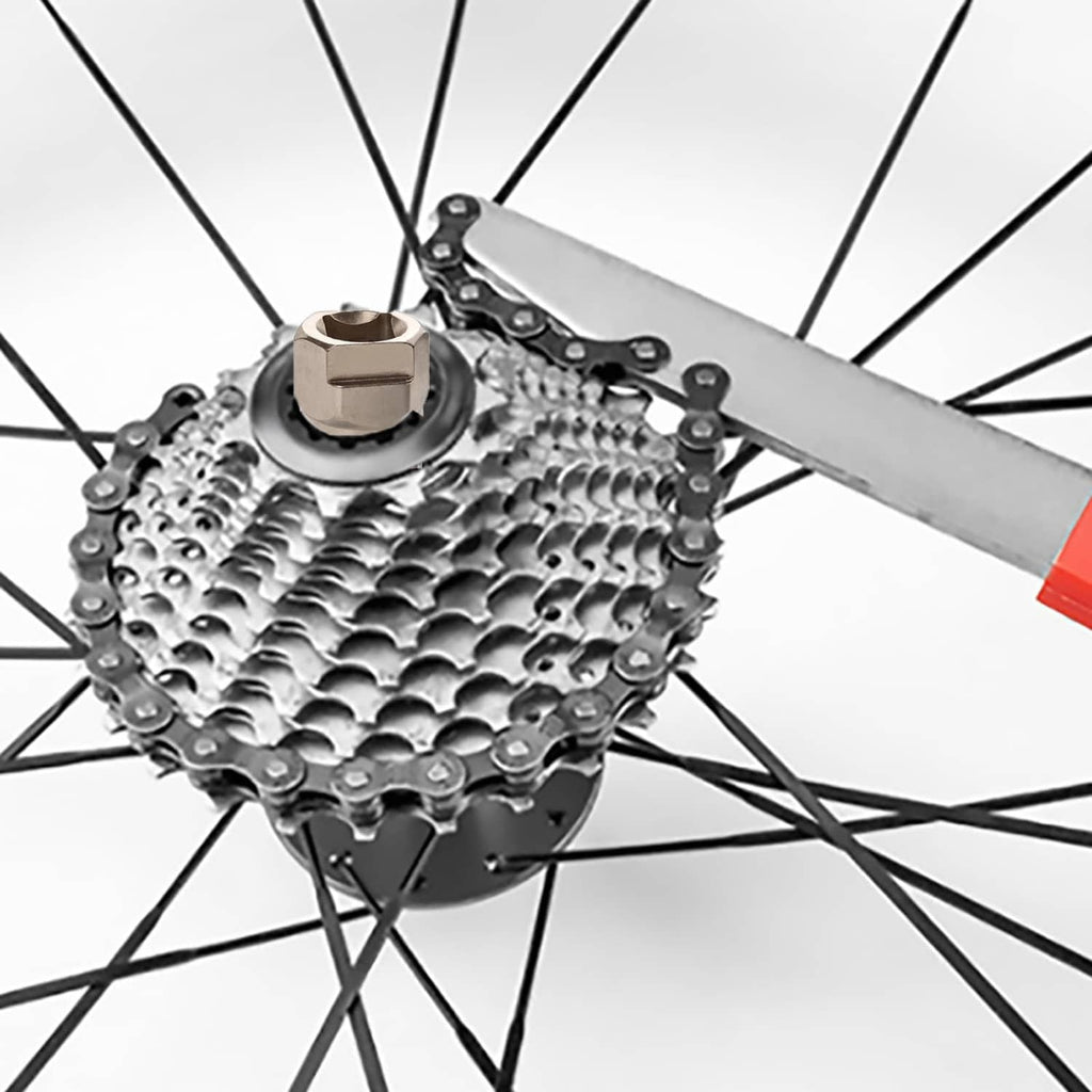 Bike freewheel removal tool with chain whip and silver socket on rear cassette