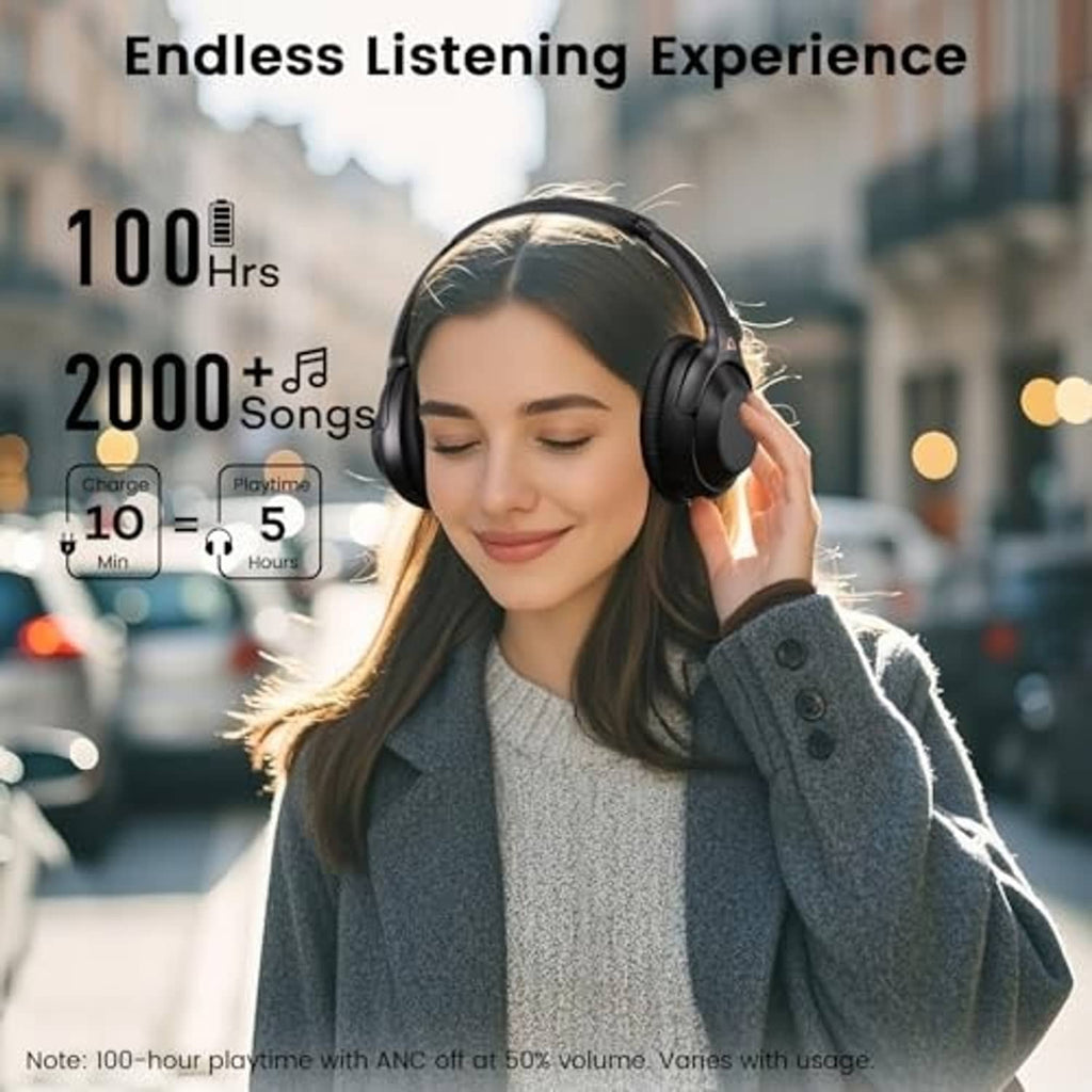 Over-ear headphones on a woman wearing a dark coat outdoors