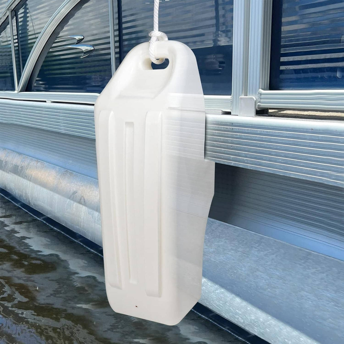 White pontoon bumper fender secured to the pontoon with a hanging loop