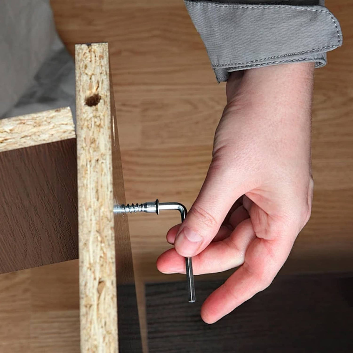 2 mm L-shaped hex key being used to tighten a screw on wood