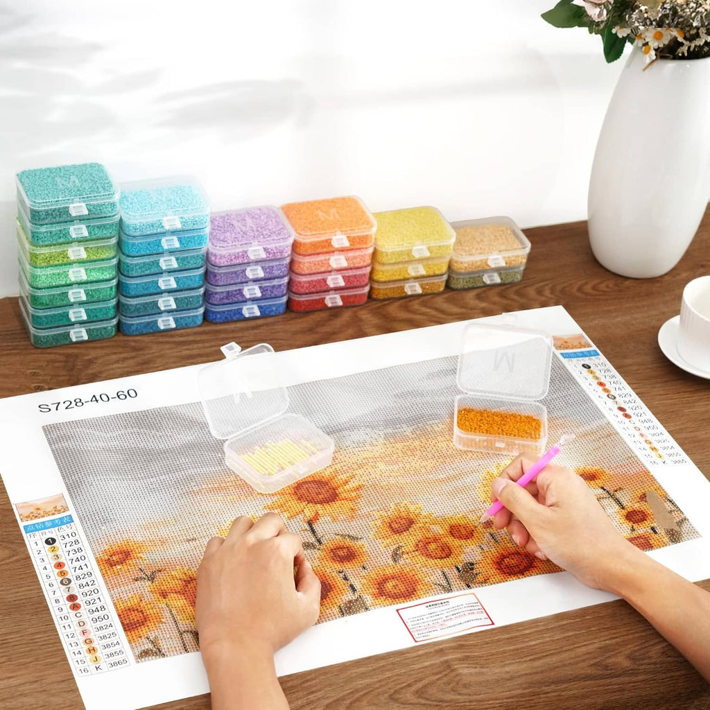 Diamond painting tray set with stacked clear containers and transparent lids on a work table