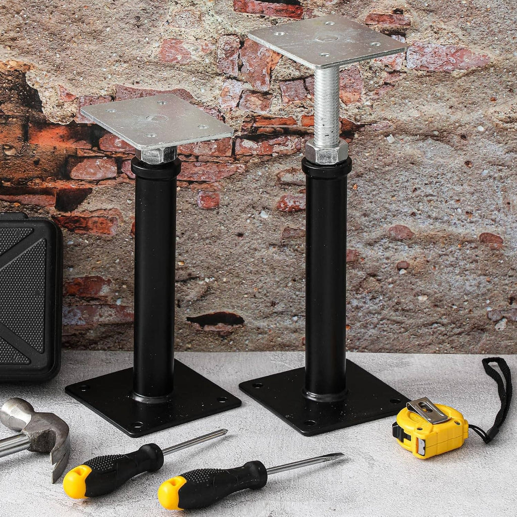 Adjustable floor screw jack post with black base and silver top plate on stone wall
