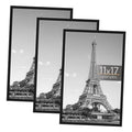 Set of three black 11x17 poster frames with clear fronts and hanging hooks, shown with Eiffel art