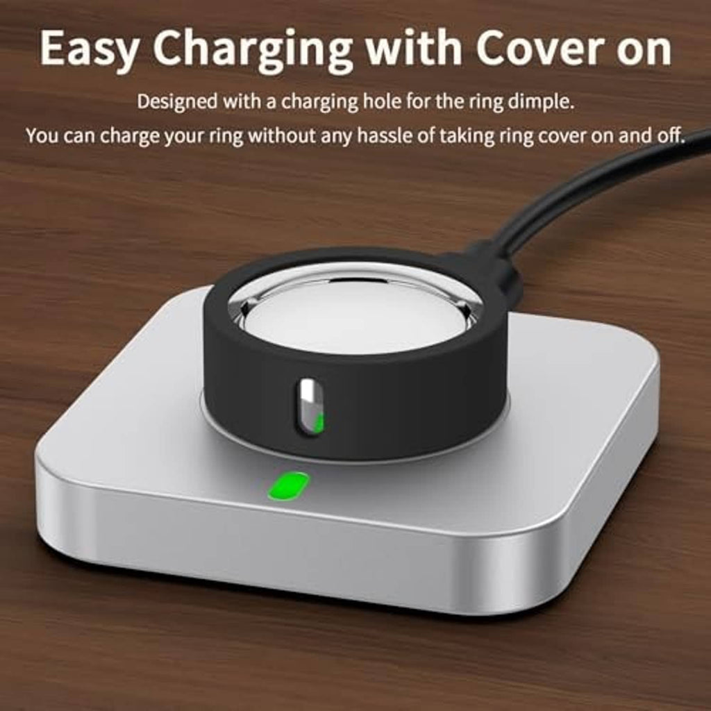 Black silicone ring cover sitting on a charging dock base with an open charging port.