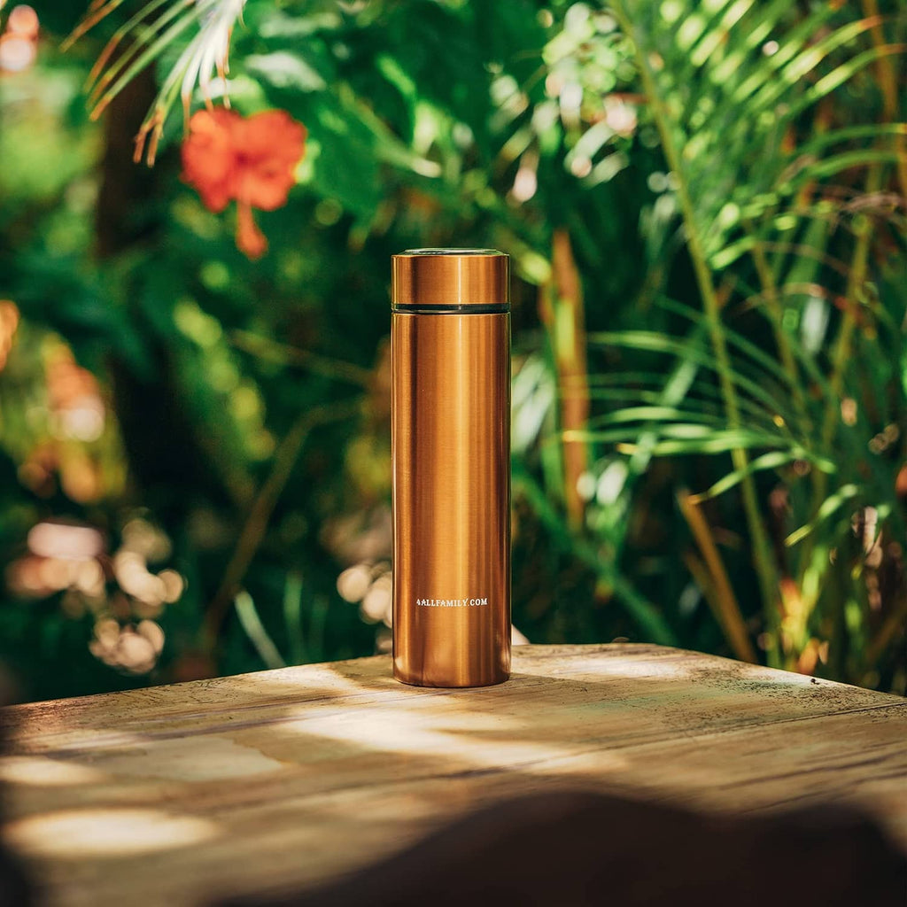 Gold insulated insulin travel case cooler standing outdoors