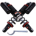 Pair of black front air shock absorbers with red rings and coil springs
