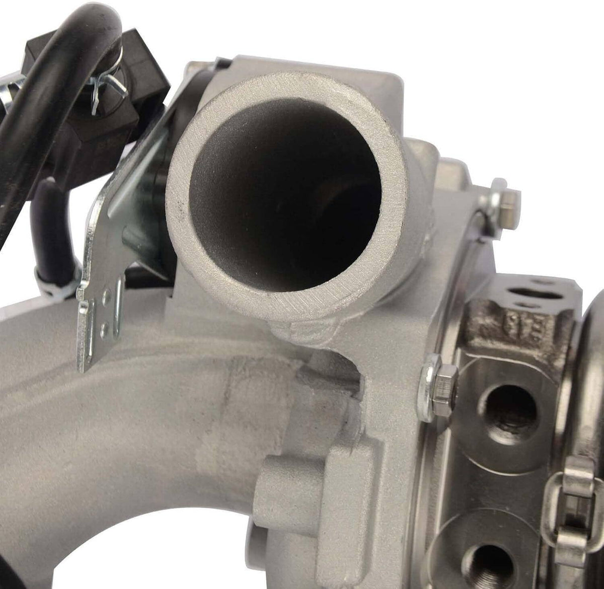 Turbocharger outlet-side close-up with circular opening and mounted bracket hardware