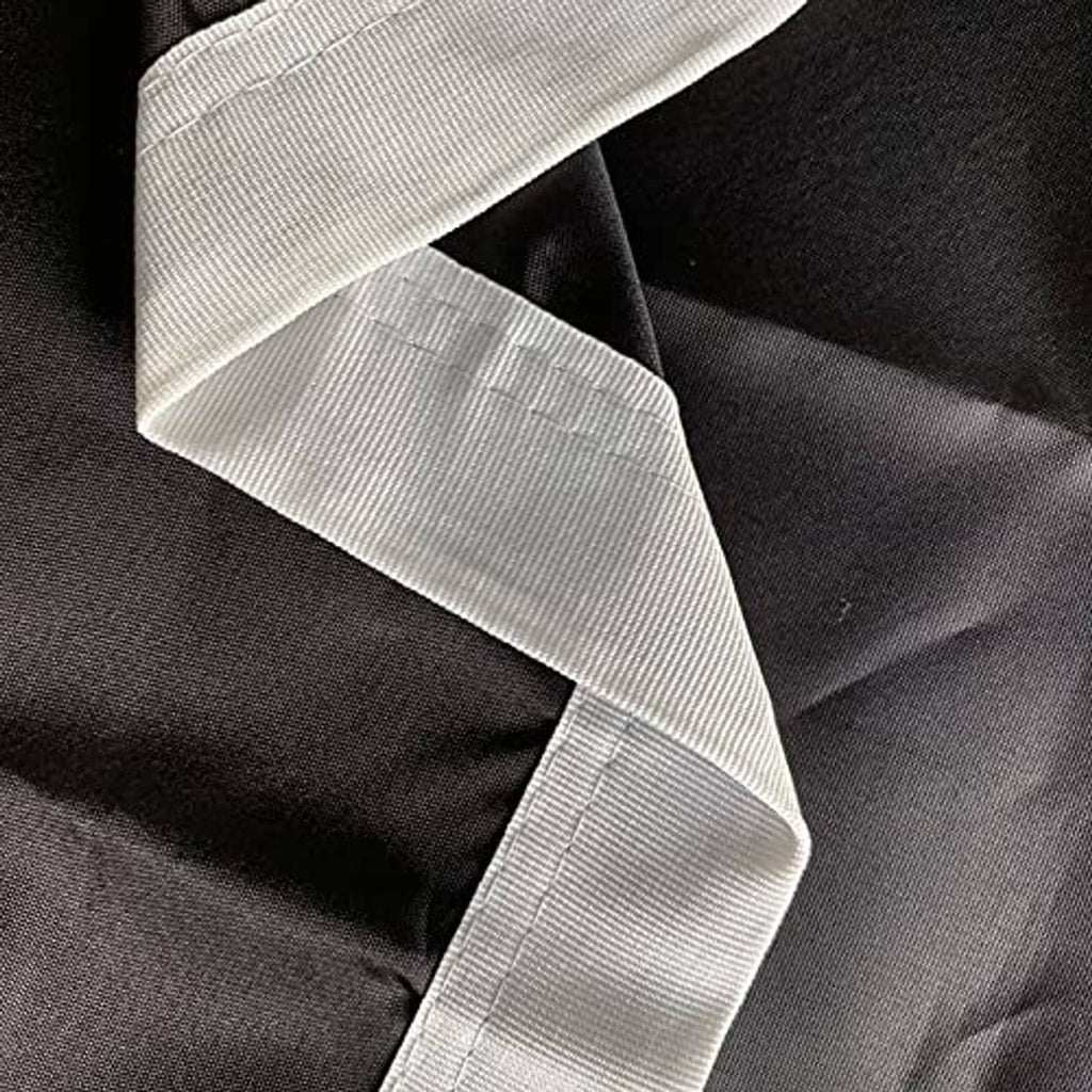 Close-up of black flag fabric with white reinforced edge and stitched border