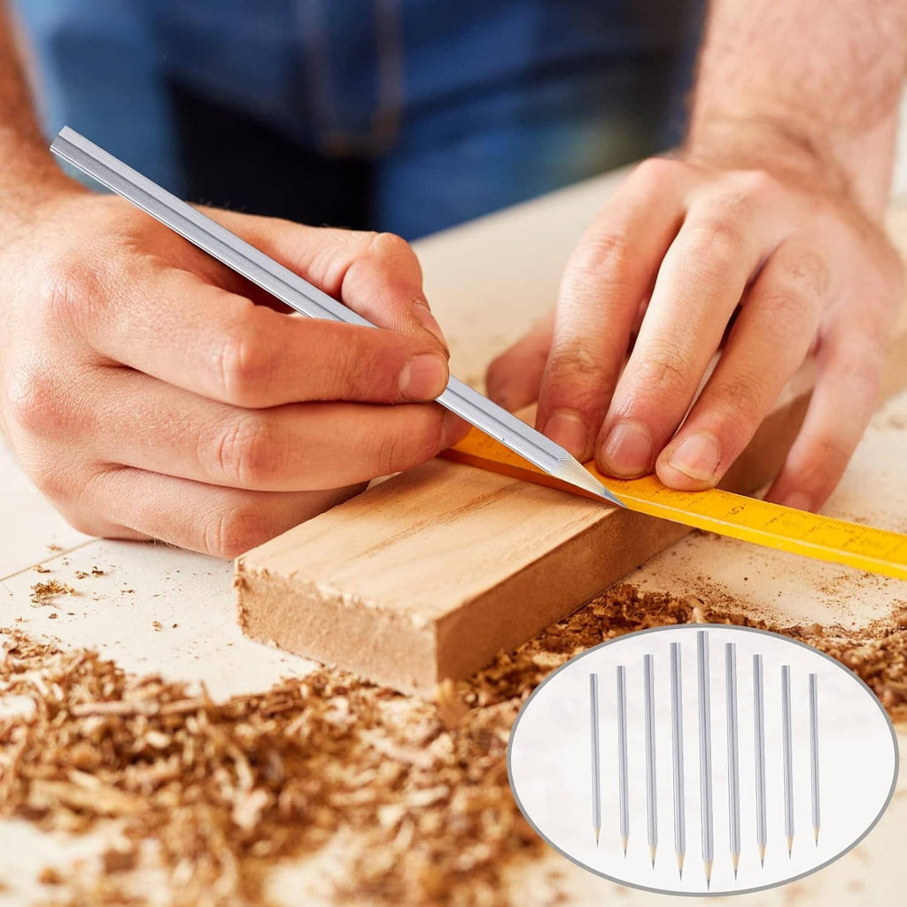 Silver marking pencil held in hands while marking a wood block.