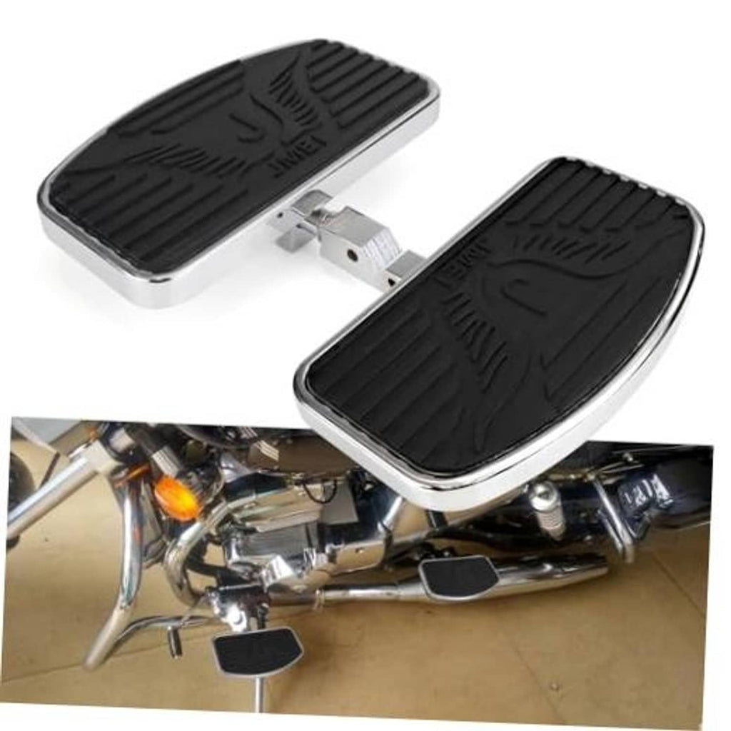 Motorcycle floorboard foot pegs installed with black tread boards and chrome trim