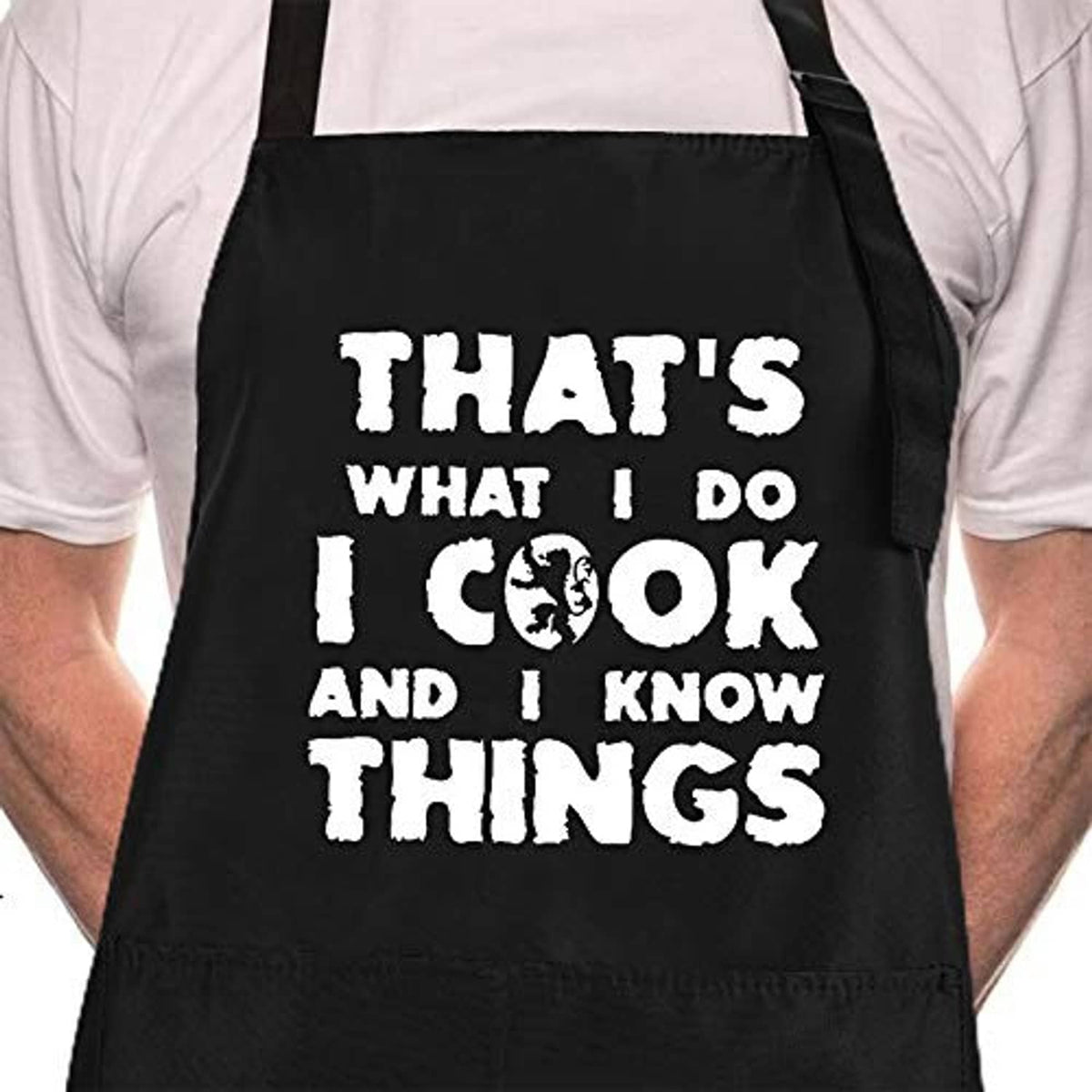 Black chef apron front with bold white 'That's what I do...' slogan