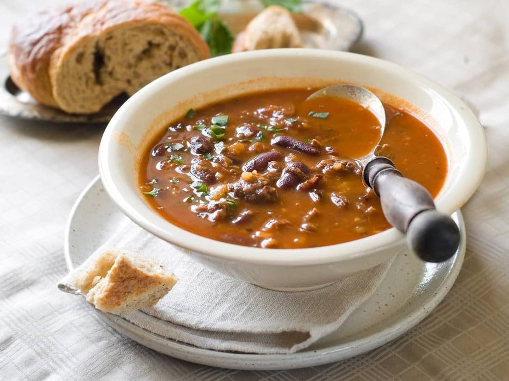 Roasted beef base sauce in a bowl with chopped beef