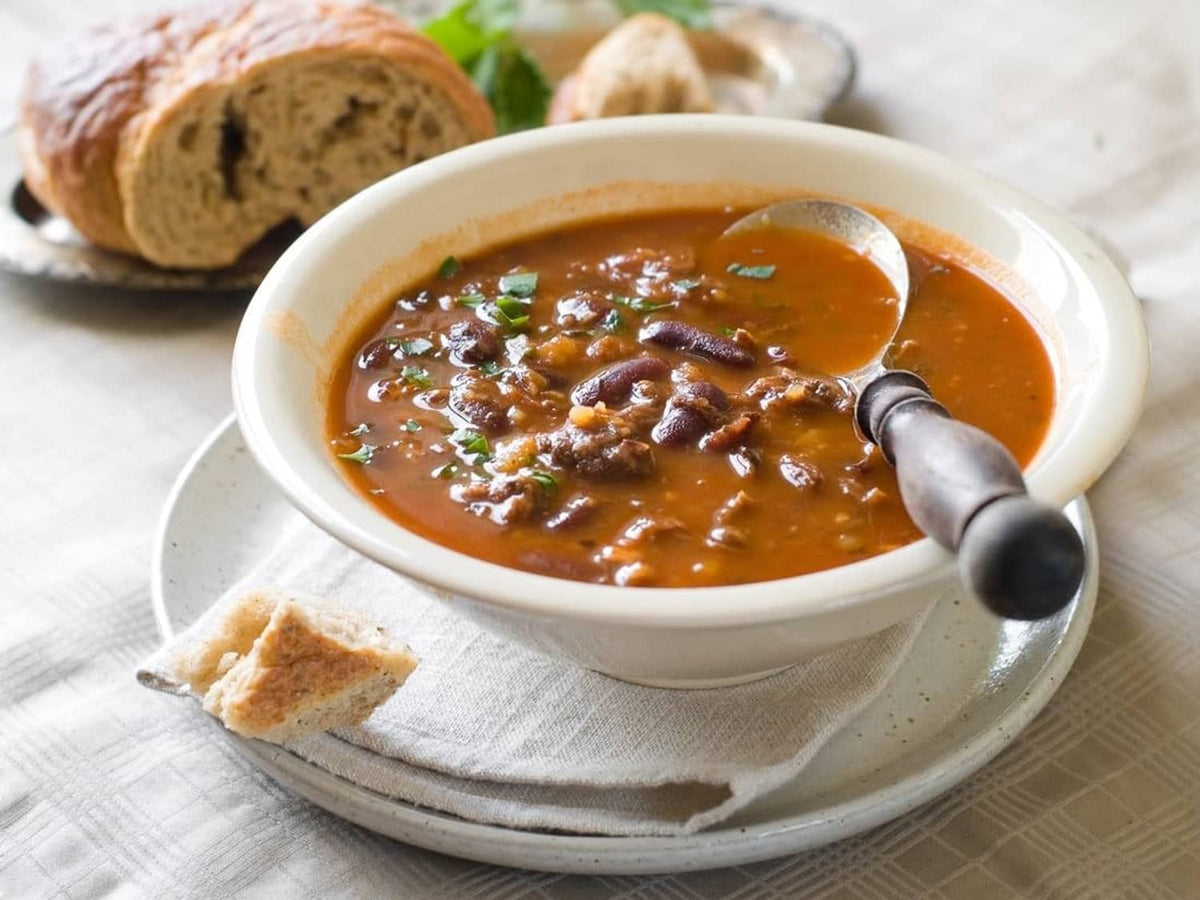Roasted beef base sauce in a bowl with chopped beef