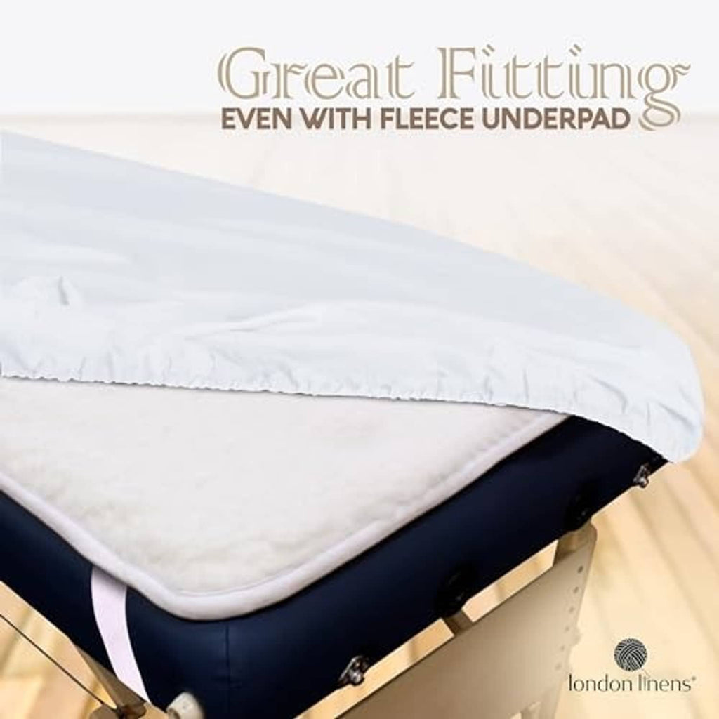 White microfiber massage table sheet with secure elastic and layered padding