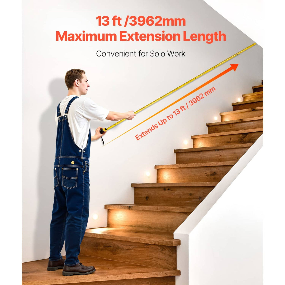 Retractable tape measure extending for long measurements on a staircase; yellow tape.