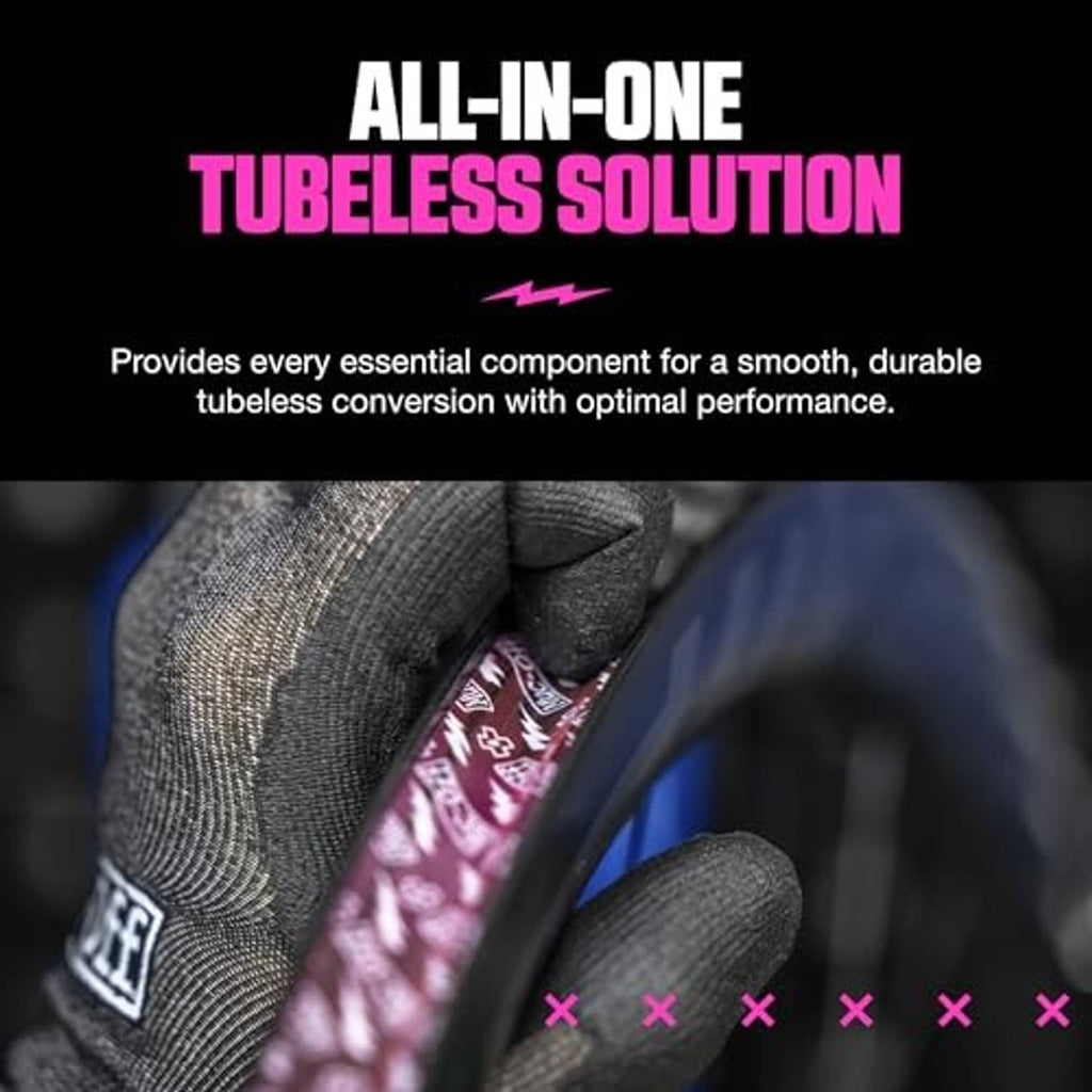 Tubeless setup kit sealant application with gloved hands holding a Muc-Off bottle