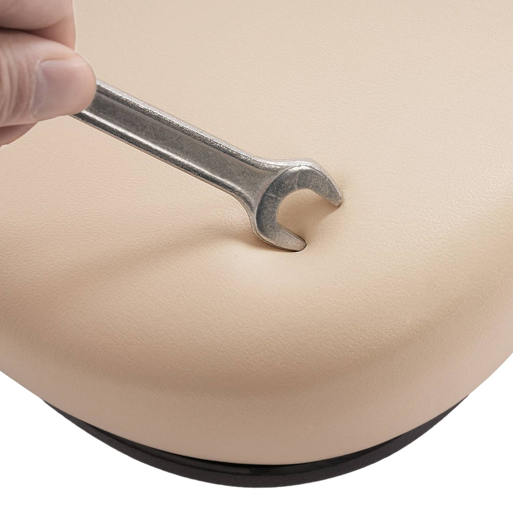 Beige seat back cushion showing a silver mounting tool near the edge