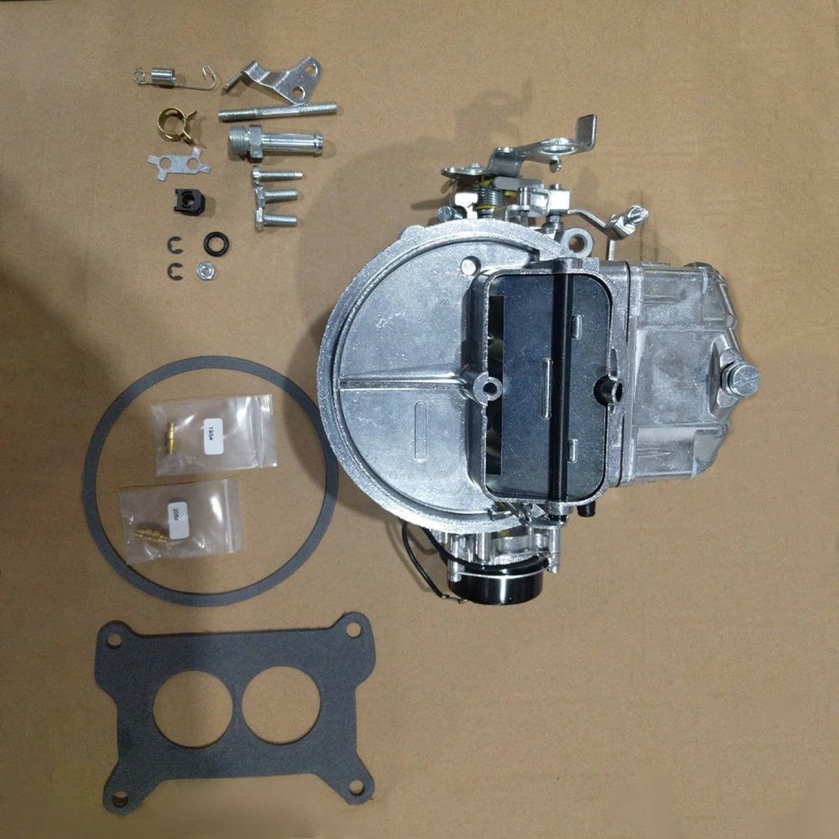 Electric-choke carburetor kit with gasket, screws, and mounting hardware
