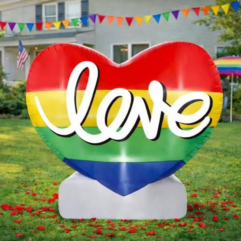 Inflatable Pride rainbow heart decoration with 'Love' script and white base