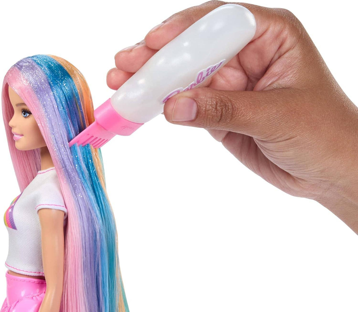 Rainbow hair doll with pastel long hair; hand combs hair with a white-and-pink brush.