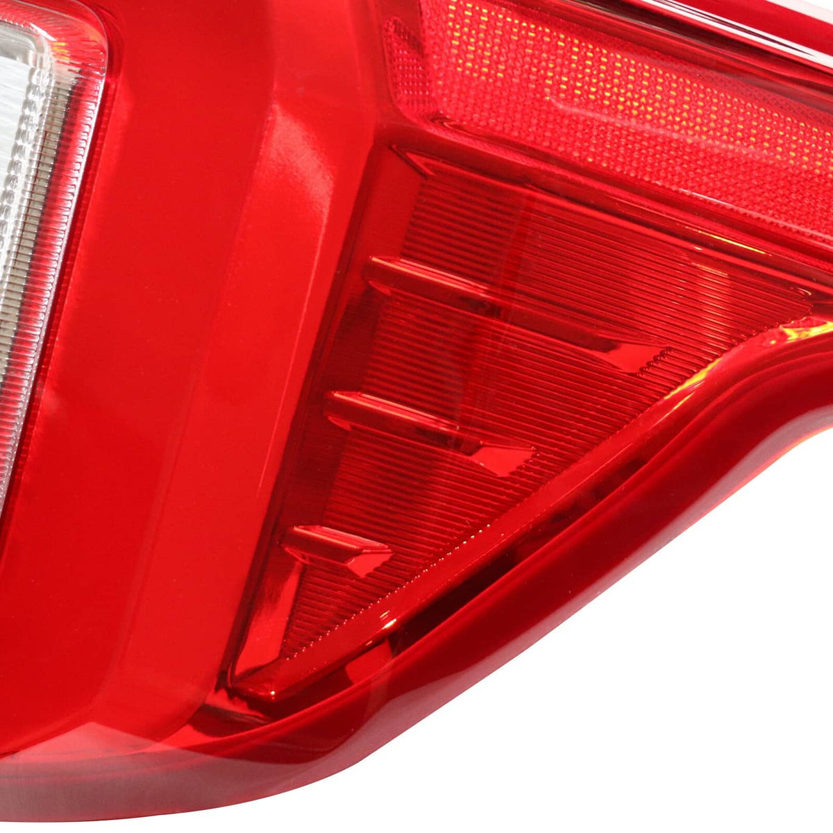 Right rear LED tail light red reflector and ribbed lens section close-up