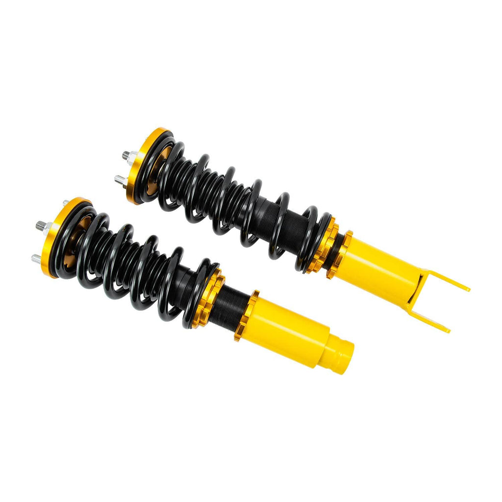 Pair of coilover shocks with black springs and yellow dampers shown at an angle