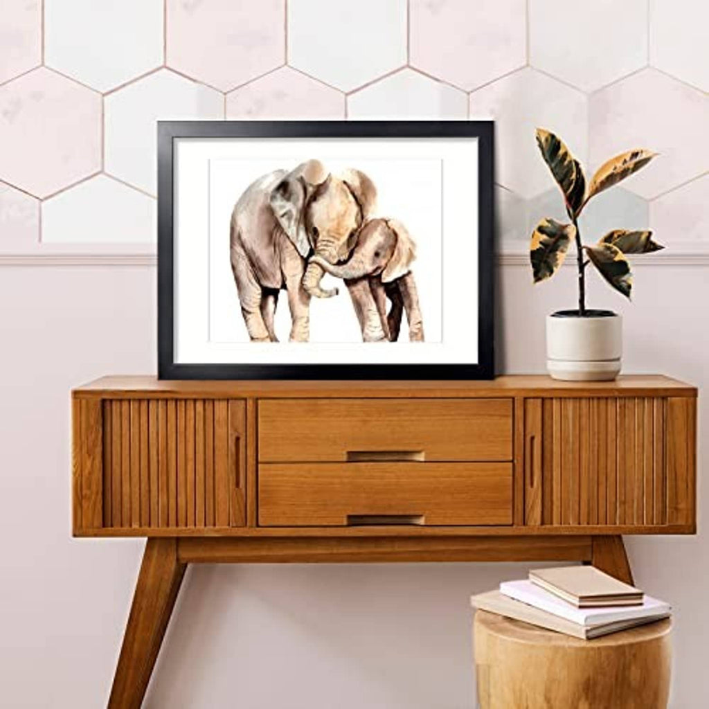 Black picture frame with white mat, holding elephant photo print
