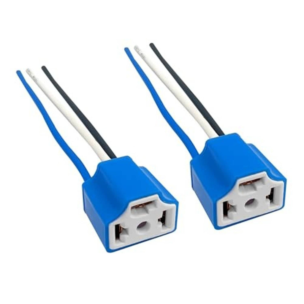Pair of blue female headlight wiring connectors with white and black wire leads
