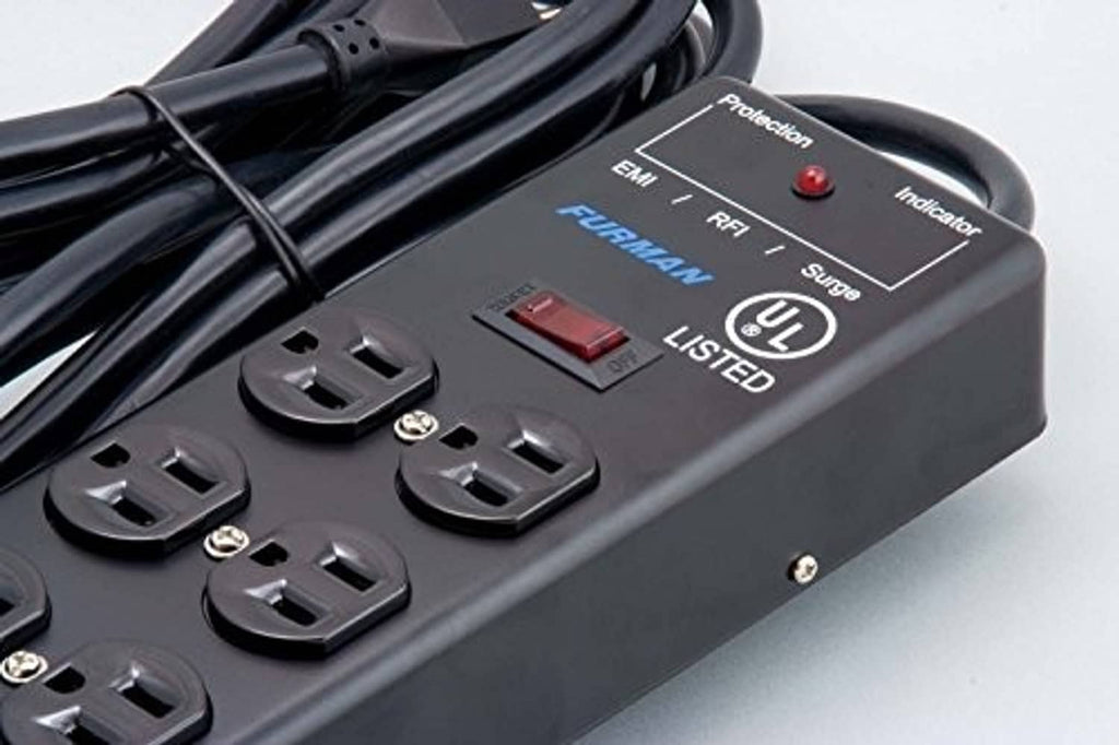 Black power conditioner close-up showing AC outlets and red rocker switch