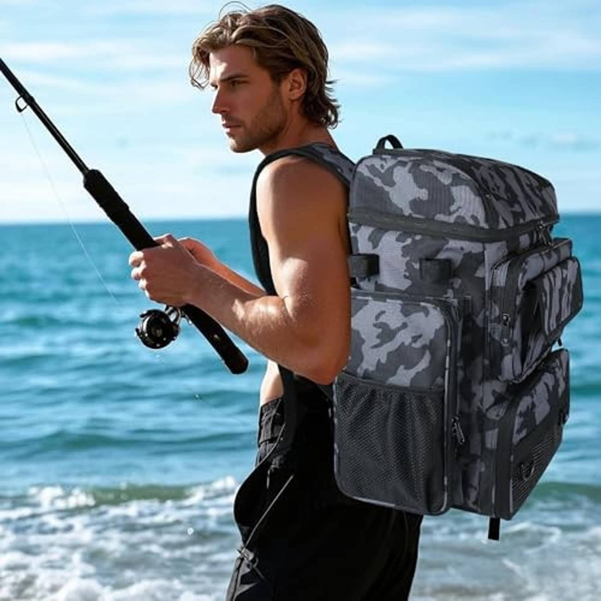 Camouflage black fishing tackle backpack with rod holders worn by an outdoor angler