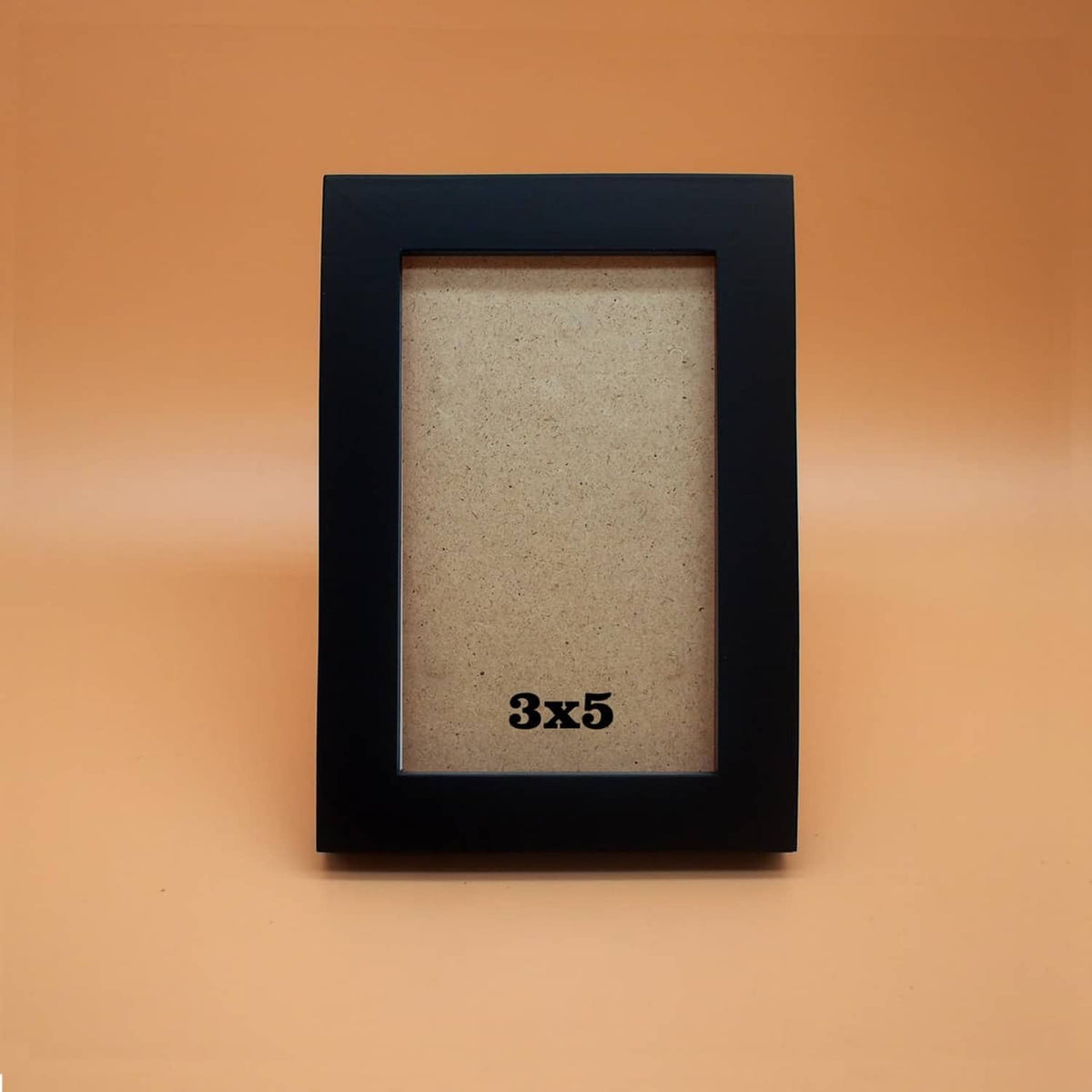 Black 3x5 picture frame with clear acrylic front, tan backing, front display view