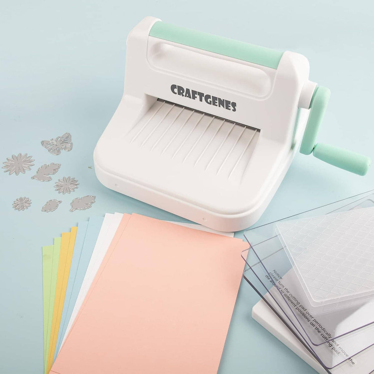 Manual die cutting and embossing machine with card stock and emboss folder