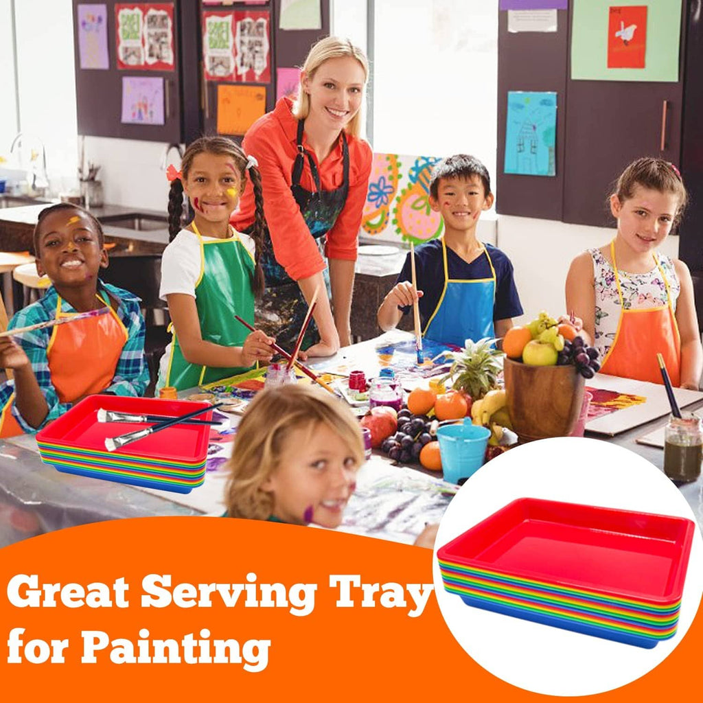 Kid crafting with multicolor plastic serving trays, red stack tray at table