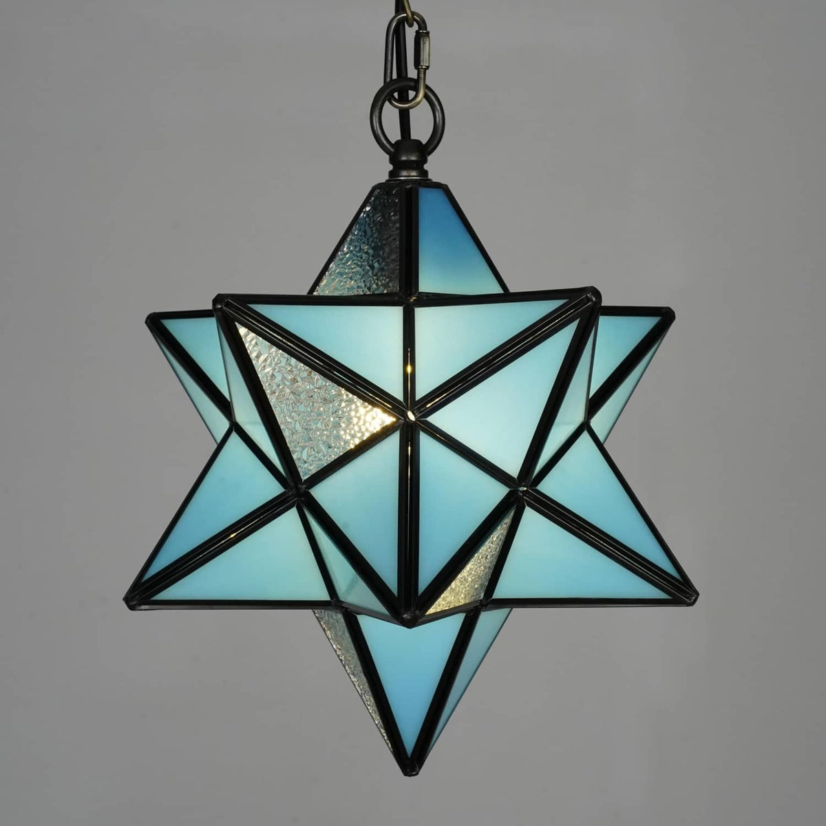 Blue stained glass star pendant light with black metal frame and chain