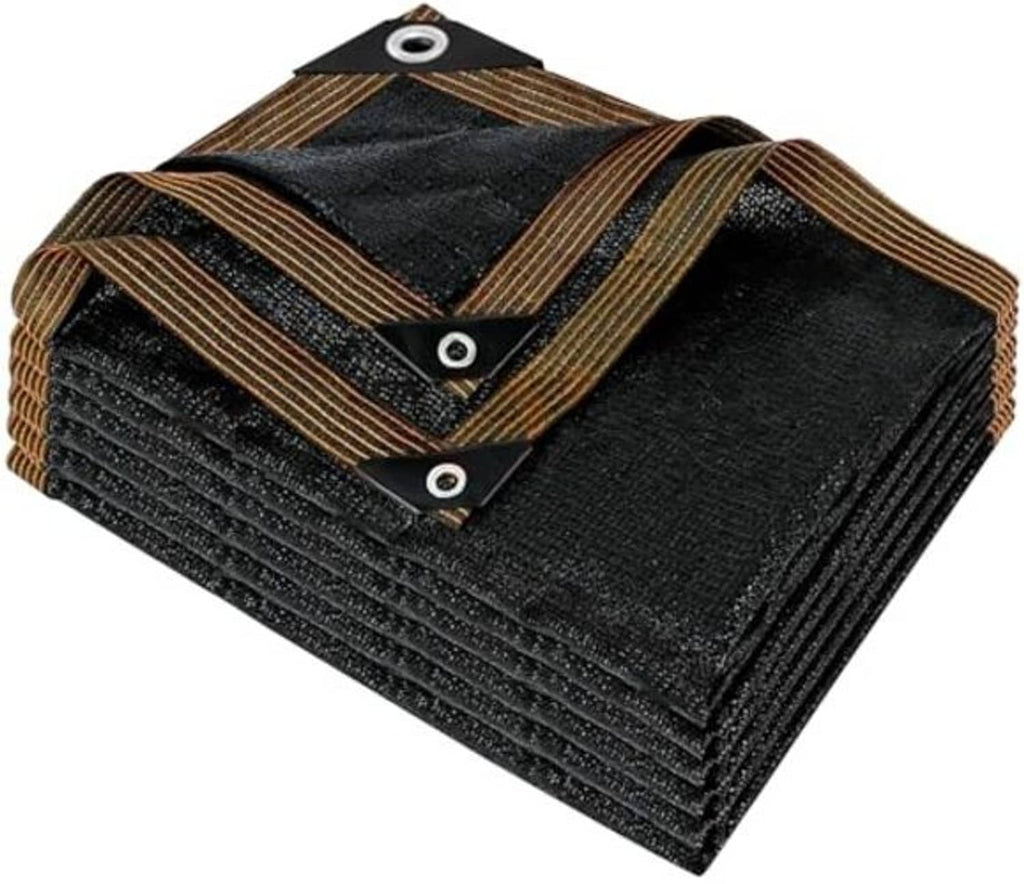 Folded black mesh shade tarp with brown striped edges and metal grommets