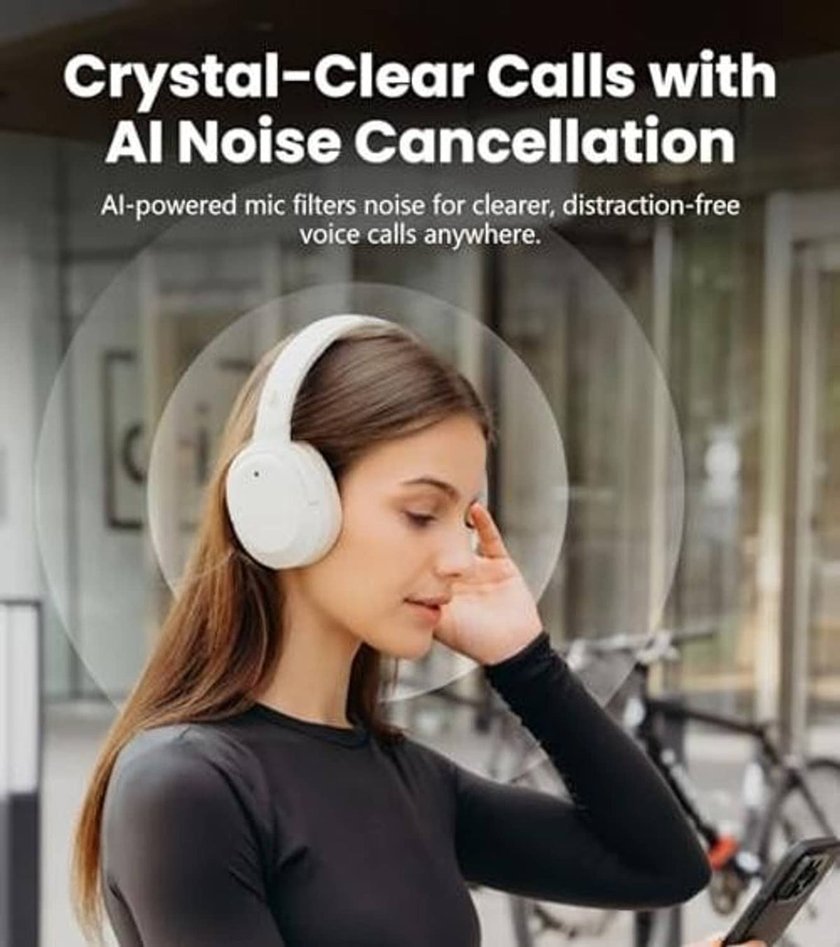 Ivory over-ear headphones worn over ears, showing rounded ear cup design.