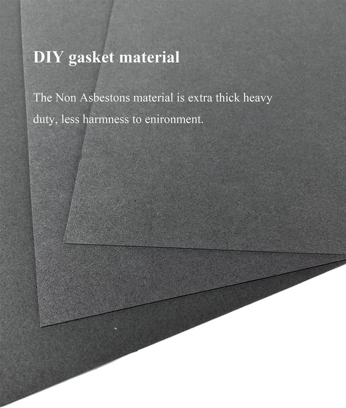Close-up of layered dark gray gasket paper sheets with clean, flat corners
