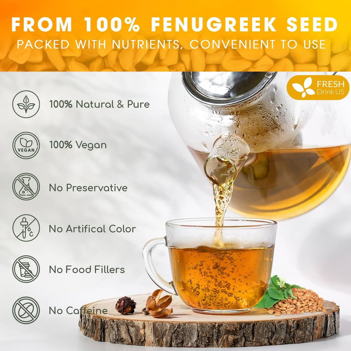 Glass teacup of golden tea with fenugreek seeds on a wood slice