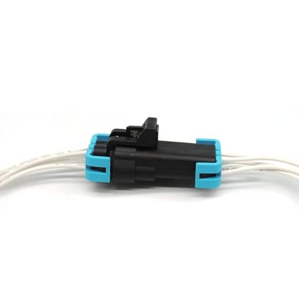 Sealed headlight connector pigtail body with teal side latches and white wire leads