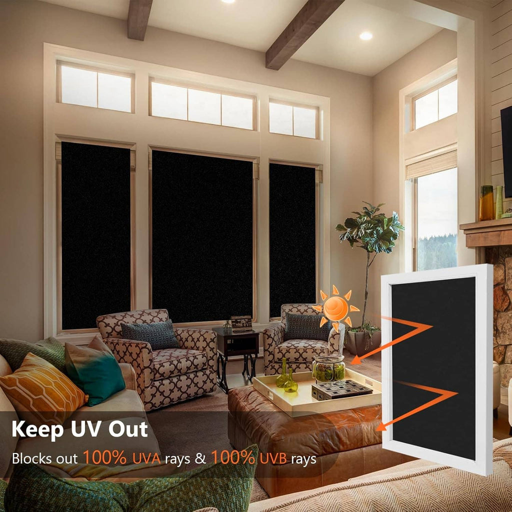 Blackout window film installed over multiple window panes for privacy and light blocking