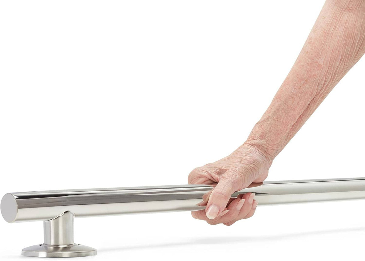 Hand gripping a polished stainless steel shower grab bar on a wall mount