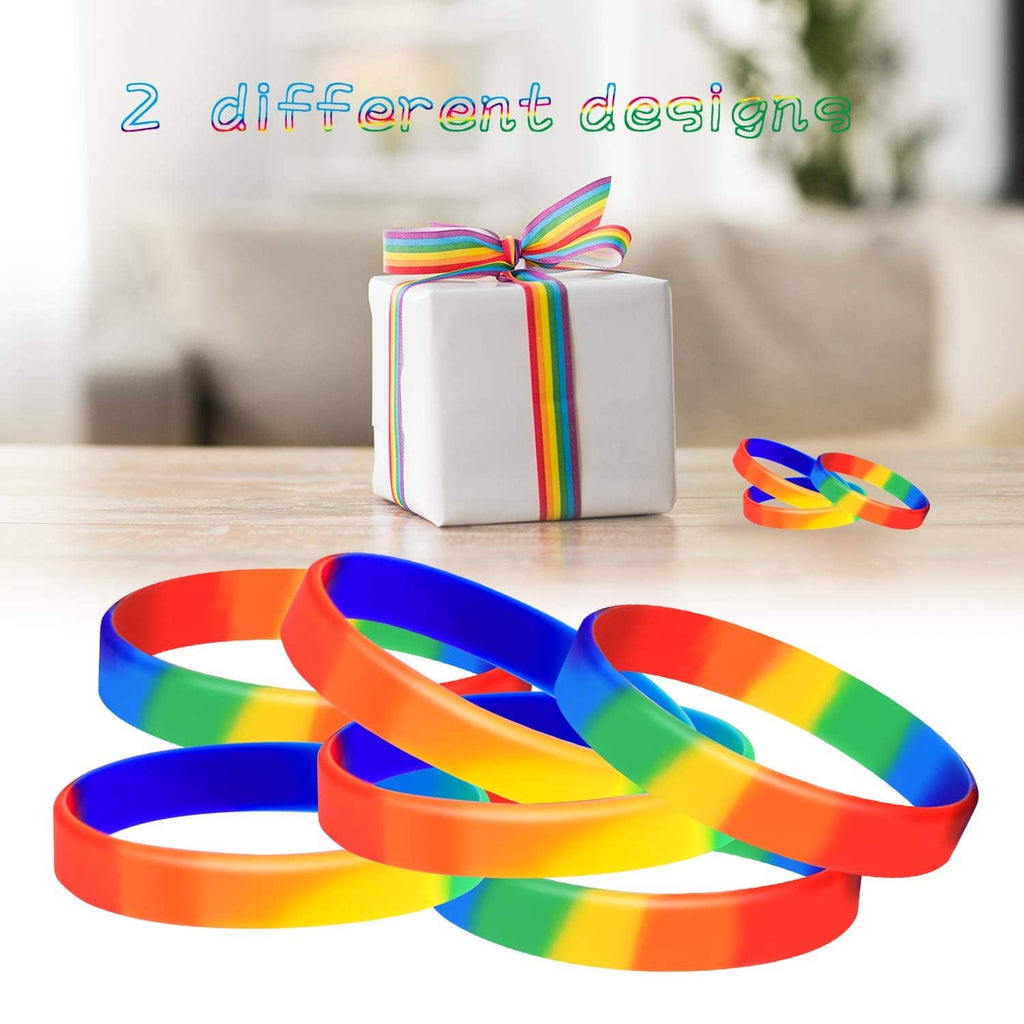 Rainbow striped wristbands laid out with a small gift box and ribbon in view