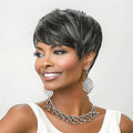 Short pixie cut wig in dark black with grey highlights, layered texture, side-swept bangs.