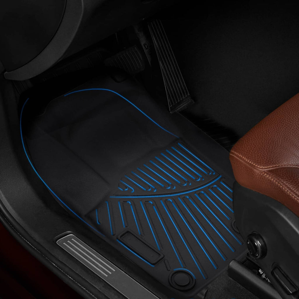 Black floor mats with ridges and blue underside channels for traction