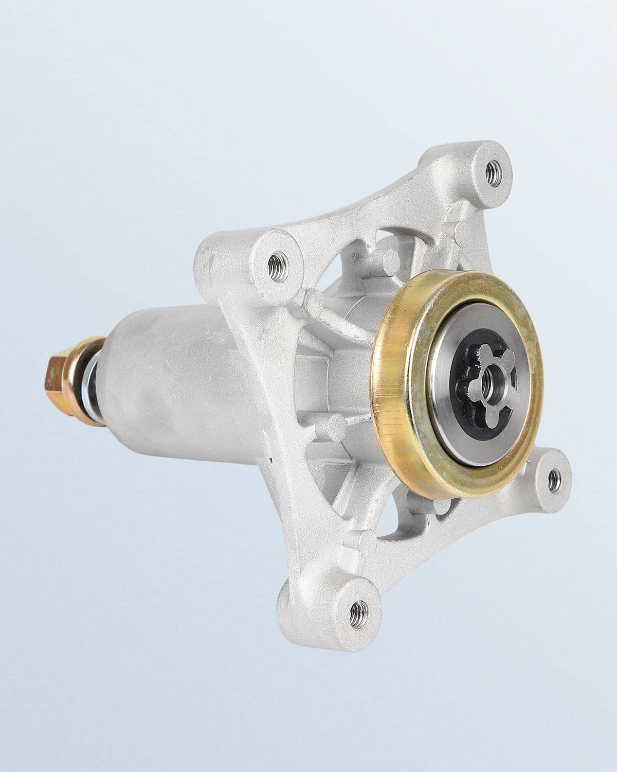 Silver lawn mower spindle housing with gold bushing and black star coupler insert.