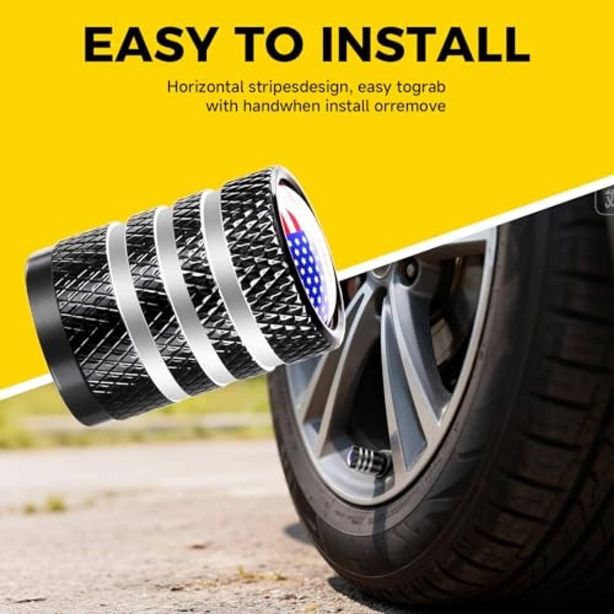 Black tire valve stem cap with U.S. flag emblem installed on a car tire valve, striped design.